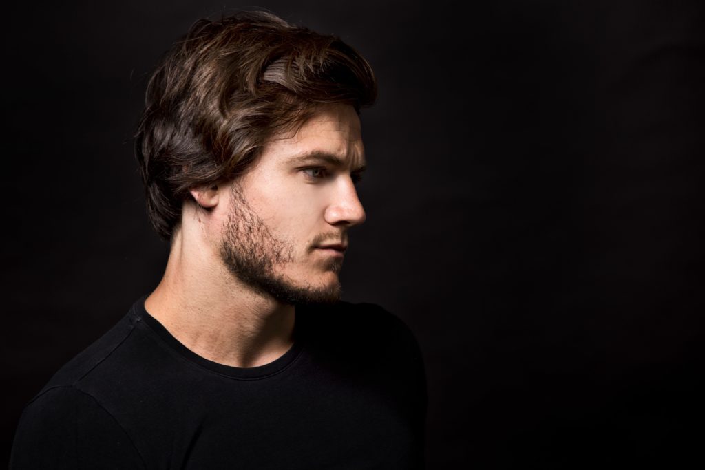 caucasian-man-wearing-black-tshirt-and-trendy-PWJR5Q5-min